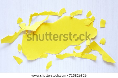 Piece of blank yellow paper for text on white wooden background