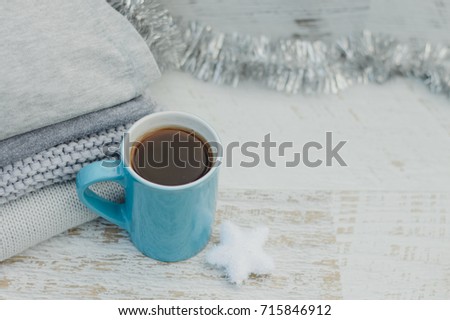 blue mug of tea warm on a cold winter day before Christmas