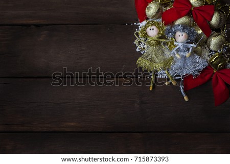 Beautiful image of New Year's toys Fairies on a wooden background.