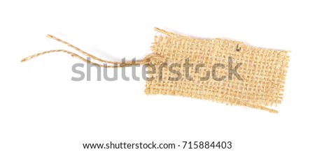 Blank textile, jute, linen tied tag isolated on white background