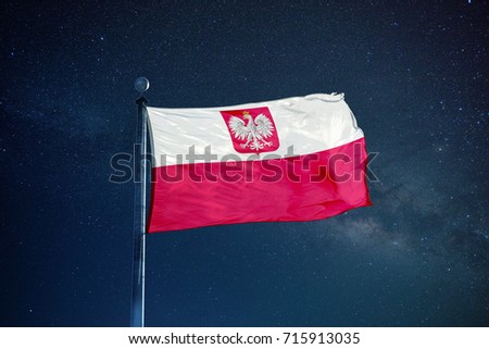 Poland flag on the mast over milky way