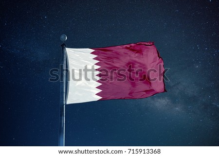Quatar flag on the mast over milky way