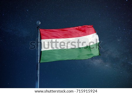 Hungar flag on the mast over milky way