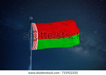 Belarus flag on the mast over milky way