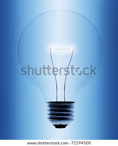 Light bulb close-up on blue gradient background