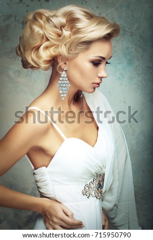 Beautiful bride with fashion wedding hairstyle - close up pictur