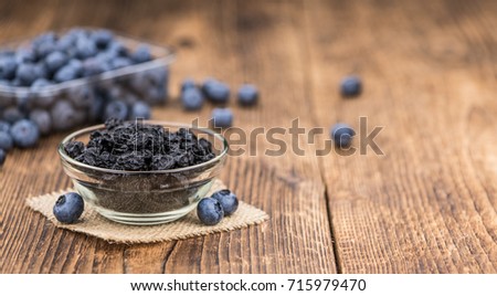 Fresh made Dried Blueberries on a vintage background as detailed close-up shot