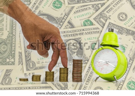 Double exposure of Concept of saving money Male hand steps on money coin like stack growing with green clock and dollar money background 