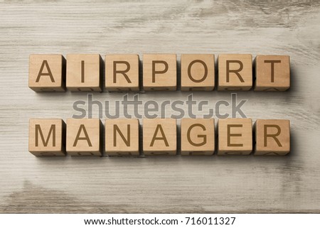 airport manager text on wooden cubes on wooden background