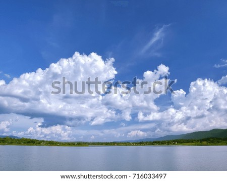 Beautiful landscape with deep blue lake ,forest and blue sky.
