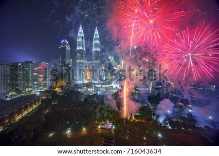 Fireworks display show over Kuala Lumpur city skyline Royalty-Free Stock Photo #716043634