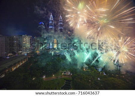 Fireworks display show over Kuala Lumpur city skyline Royalty-Free Stock Photo #716043637