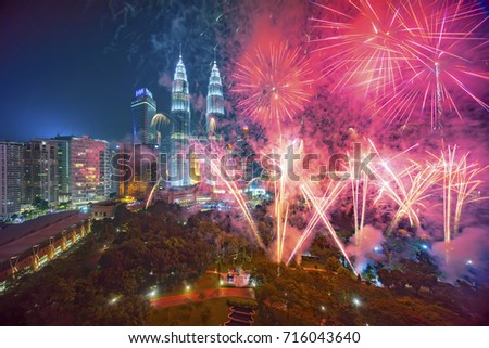Fireworks display show over Kuala Lumpur city skyline Royalty-Free Stock Photo #716043640