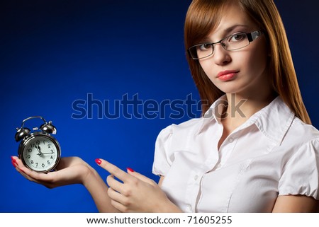 business woman and alarm clock, deadline concept over blue