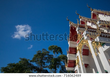 Thai temple roof on blue sky background / Thai art