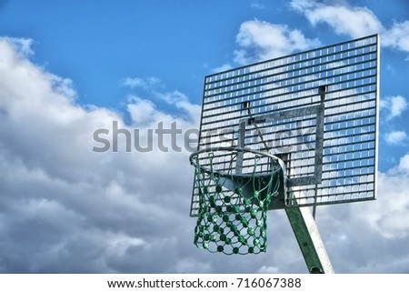 Looking up on an outdoor basketball hoop in Norway