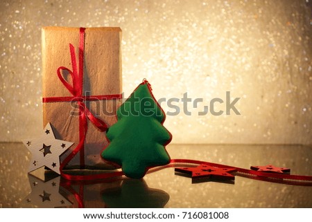 beautiful Christmas gift with red ribbon and Christmas tree on a brilliant white background 