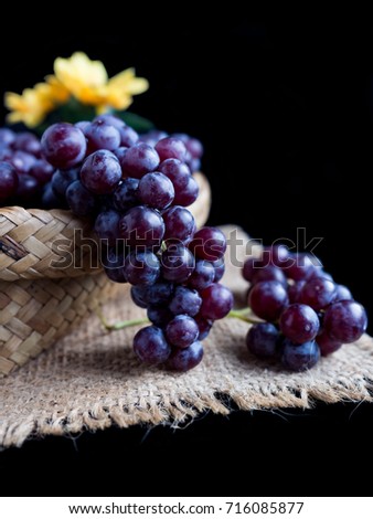 Seedless Grapes on black and wood background ready to serve