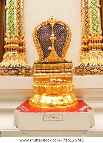 Golden limestone to make peple know where the boundary  of Assembly Hall at Buddhism temple . Thai messages below it meaning not permitted to light a candle and incense  here .