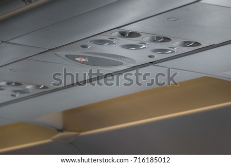 No Smoking sign Overhead vents and in-flight lights