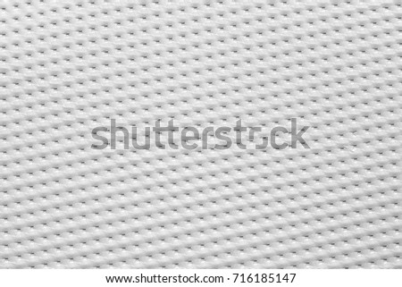 Texture of vinyl paper perforated sheets white color, abstract background