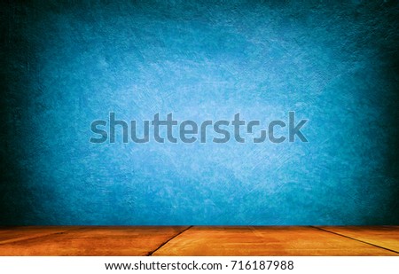 Dark blue Concrete texture backdrop with wooden shelf