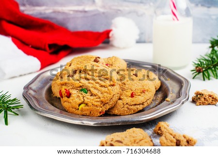 Cookies and milk for Santa on white snow background. Space for text