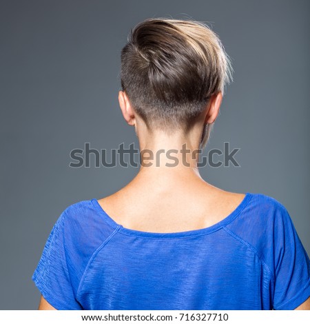 Image of woman with short hairstyle, view from behind. Haircut. Hairstyle Royalty-Free Stock Photo #716327710