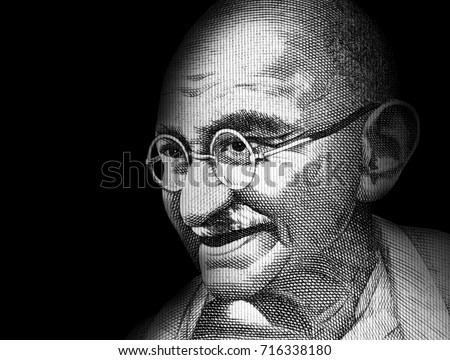 A piece of a money bill showing an important person Royalty-Free Stock Photo #716338180