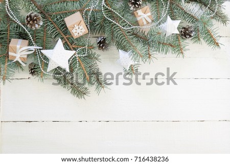 Merry Christmas and Happy New Year. Christmas Decorative Ornate Fir Glitter Natural Gifts on white wooden Background. Holiday Concept.