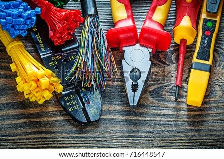 Electrical tester wires tying cables bolt cutter pliers insulati Royalty-Free Stock Photo #716448547