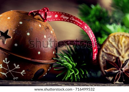Jingle bell christmas decorations and ribbon with text Happy christmas.
