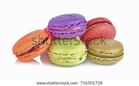Delicious three multicolored macaroon on a white background