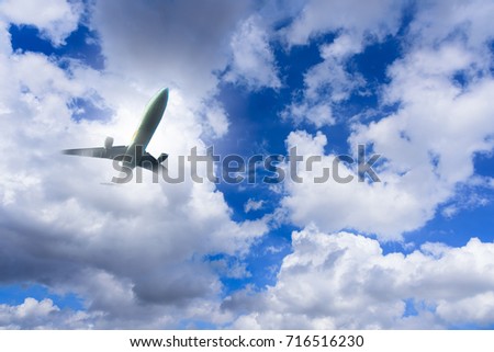 Airplane has takeoff in the blue sky background and white big cloud at sunrise in the morning on vacation and relax time. Travel, Journey, Vacation and Recreation concept.