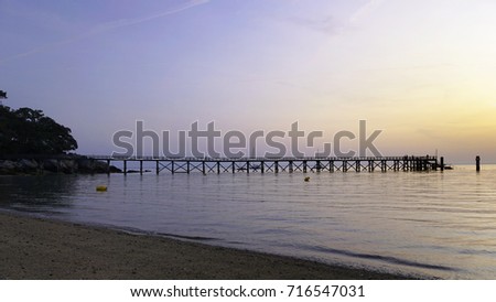 sunrise over the pier at the beach of the ladies in Noirmoutier island, France 