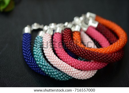 Bead crochet bracelets different colors on a dark background