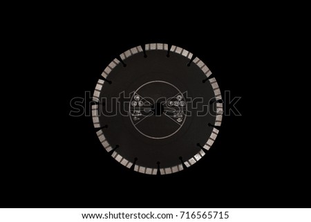 Cutting disc with diamonds - Diamond disc for concrete isolated on the black background