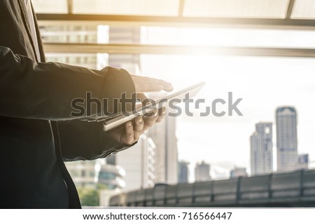 businessman hold tablet, technology, internet and networking concept - Close up image of business man holding a digital tablet planning business digital strategy achievement
