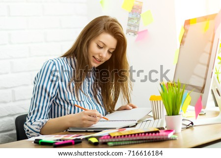 Young designer working in office