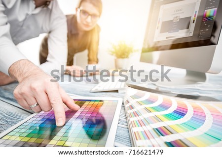 Graphic designer at work. Color swatch samples. Royalty-Free Stock Photo #716621479