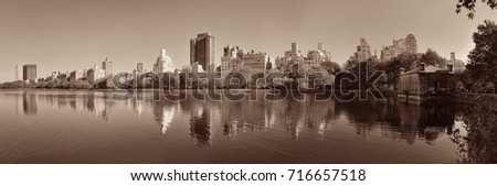 Central park Manhattan east side luxury building panorama over lake in Autumn in New York City.