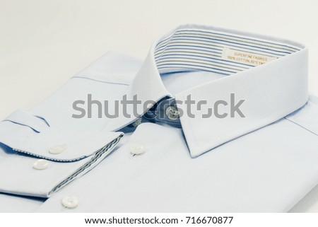 shirt collar of light blue shirt isolate on white