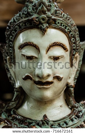 Face of Thai male angel traditional style ceramc sculpture