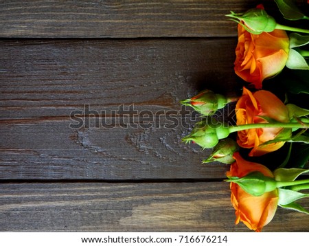 Roses on a wooden background.