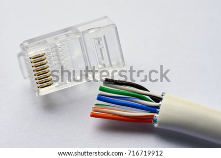 Setting up a cable for a local network twisted-pair category utp 5e Royalty-Free Stock Photo #716719912