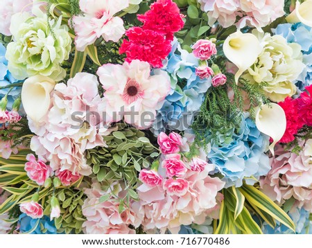 beautiful artificial flowers on artistic background, flower pattern