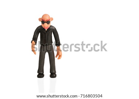 Bald plasticine man with glasses extends a hand for handshake isolated on white background