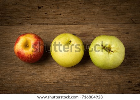 fruit traffic light concept. apple red. chinese pear yellow. guava green. on old wood.
