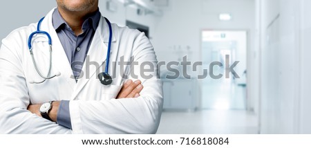 Confident doctor posing with arms crossed and stethoscope, medical advice and health insurance banner Royalty-Free Stock Photo #716818084