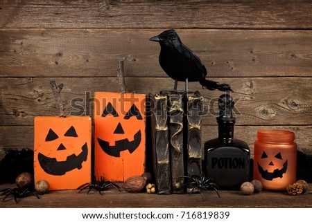 Rustic Halloween scene against an old wooden background    